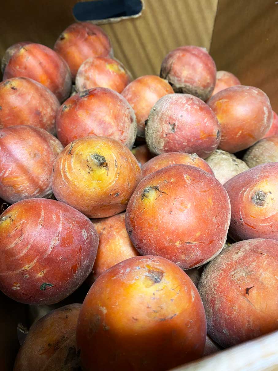 Farmfresh yellow beets in box.