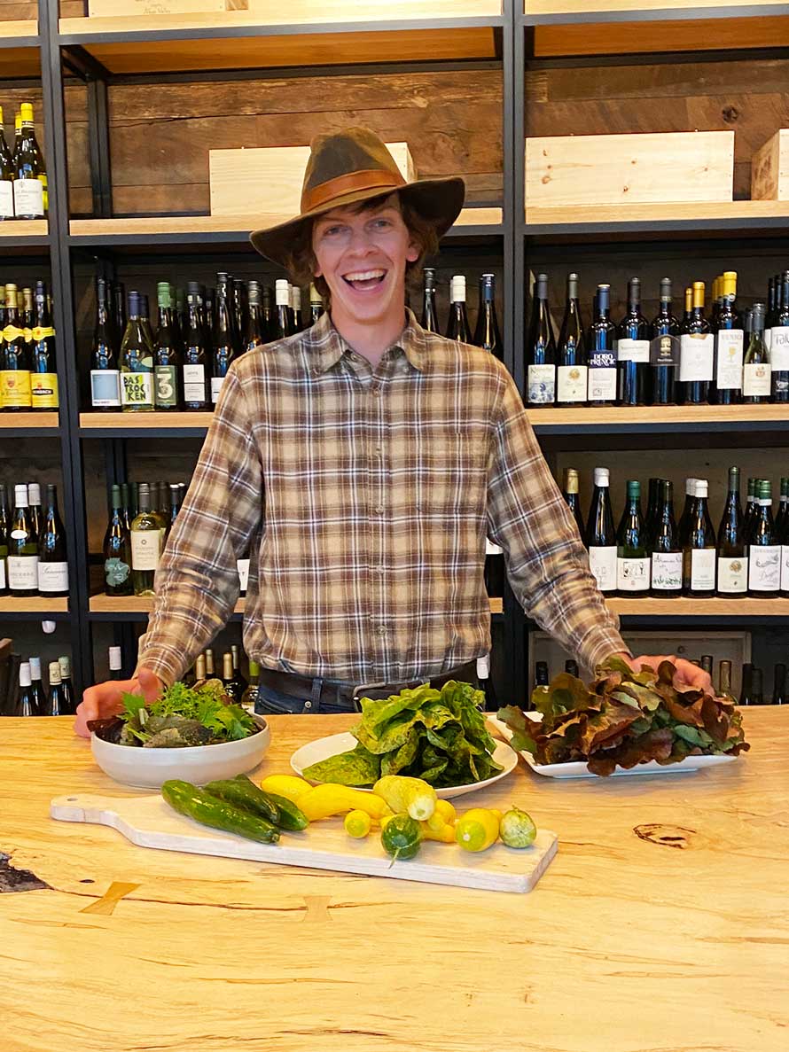 On of our local famers displaying local lettuce, squash and zucchini. 